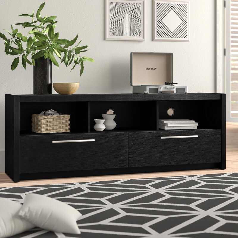 This TV stand is made out of plywood and has two drawers for storage