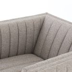 This chairs sloping arms and thick reversible seat cushion with sinuous no-sag springs. Highlighted by double material, this chair will add comfort and beauty to any room.