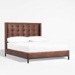 Faux Leather upholstery covers this fabric bed frame from the base to its super tall headboard.